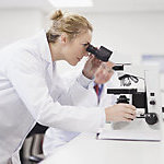 Scientist working in a pathology lab.