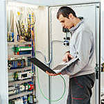 Programmer checking the quality of the software in charge of automation.