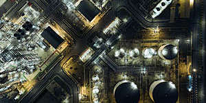 Aerial top view Oil refinery at night for energy industry or transportation background.