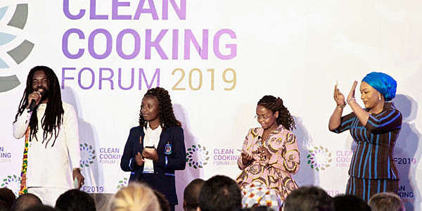 Four African people, including Samira Bawumia, the Second Lady of Ghana, and Grammy-nominated artist Rocky Dawuni, lined up at the Clean Cooking Forum 2019 in Nairobi, Kenya.