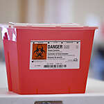 Muhlenberg, PA - April 28: A bioharad sharps container for used syringes. At the Berks Cares Vaccine Center, the county COVID-19 vaccine location setup in the North Reading Plaza shopping center in Muhlenberg Township Wednesday morning April 28, 2021. The center is a collaboration between the county and the Berks Community Health Center. (Photo by Ben Hasty/MediaNews Group/Reading Eagle via Getty Images)
